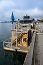 OSLO, NORWAY Ã¢â¬â JULY 11, 2022: Oslo harbor, KOK Oslo Sauna, floating sauna boat, Legacy of the Fjords cruise boat in background